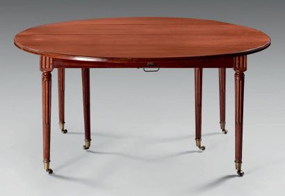 Large round mahogany dining room table with...