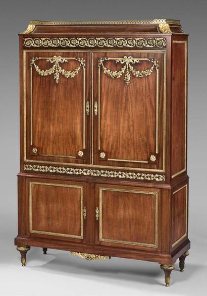 null Mahogany cabinet with four doors. Top with a doucine top. Spinning top legs....