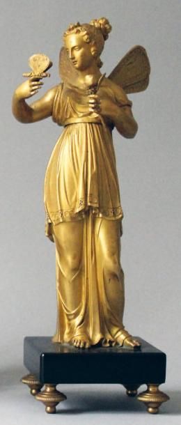 null Statuette en bronze doré mat et brillant représentant Zéphyr tenant un papillon...