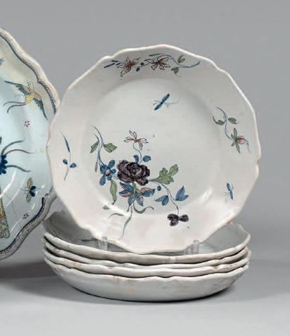 Nivernais Five plates with contoured rims, polychrome decoration of bouquets of flowers...