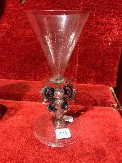 null Conical cut glass on a hollow baluster base decorated with twisted flutes framed...