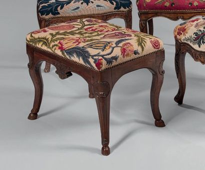 null Rectangular walnut stool carved with flowers and shells. Arched legs with hooves.
Regional...