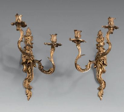 null Pair of gilt bronze wall lights with two asymmetrical animated lights. Shaft...