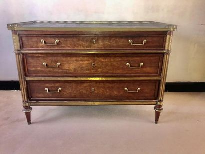 null Mahogany chest of drawers and brass moldings opening with three drawers, the...