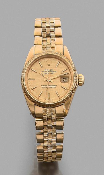 Rolex Datejust, réf. 6927, n° 5504741. 
Wristwatch in 750 thousandths 18k gold.
Bezel...