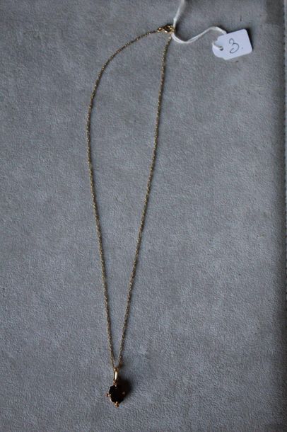 null Necklace chain in yellow gold 750 thousandths supporting as a pendant a motif...