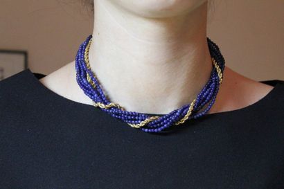 null Necklace of seven rows of sapphire balls intertwined with a twisted necklace...