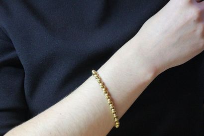 null Bracelet articulé en or jaune 750 millièmes, les maillons de forme ronde, le...