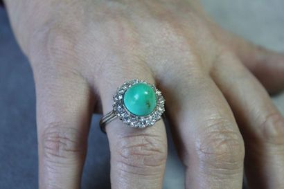 null Platinum ring 850 thousandths decorated with a turquoise cabochon in a setting...