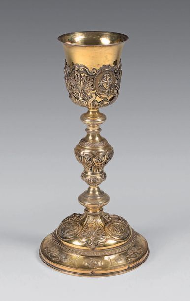 null Gilt gilt chalice embossed with medallions, vine branches, sheaves of wheat...