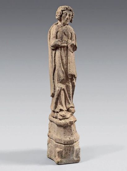 null Carved limestone statue of St. John on a pedestal.
A 16th century architectural...