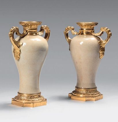 null Pair of small baluster-shaped vases in cracked porcelain with a gilt bronze...