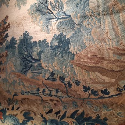 null Tapestry in wool and silk decorated with a landscape with large trees between...