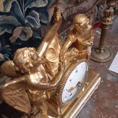 null Gilt bronze clock decorated with an allegory of Love and Friendship. White marble...