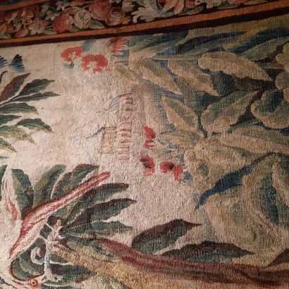 null Green wool and silk tapestry decorated with an exotic tree with a bird devouring...