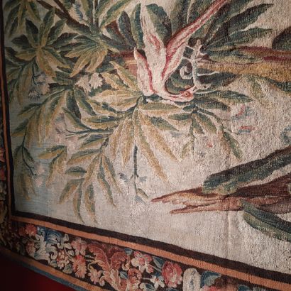 null Green wool and silk tapestry decorated with an exotic tree with a bird devouring...