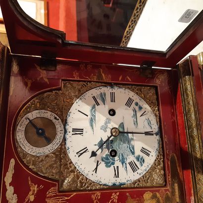 null Religious" clock in red lacquered wood and gold and ormolu with Chinese decoration....