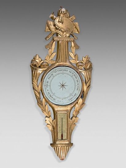 null Barometer-thermometer in a gilded wooden frame carved with a music trophy and...