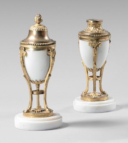 null Pair of small white marble and gilt bronze candlesticks with three uprights...