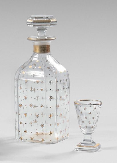 null Liquor set including four covered bottles and four small crystal glasses with...