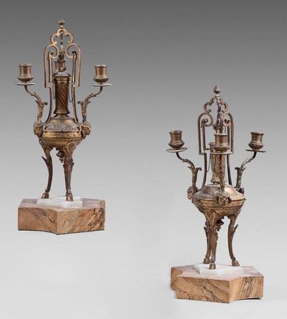 null Pair of antique tripod-shaped three-light gilt bronze candelabra. White marble...
