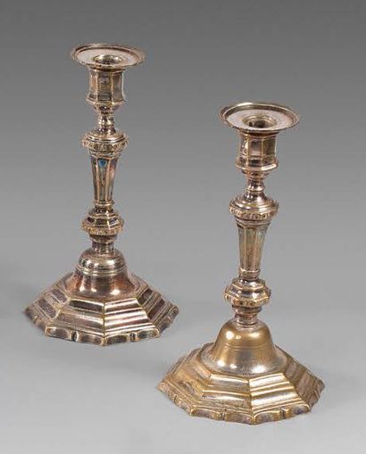 null Pair of silver plated metal torches. Panelled fut, contoured base. Punched with...