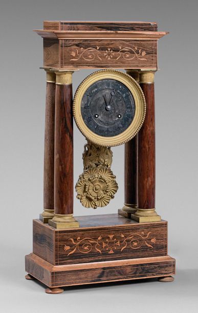 null Portico clock with four rosewood columns inlaid with light wood scrolls. Silver...