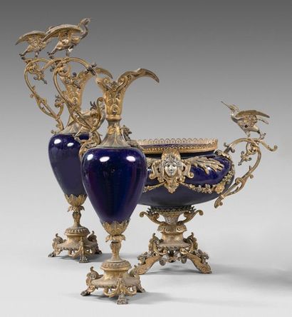 null Pair of simulated ewers and oval planter in blue porcelain with rich gold metal...