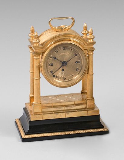 null Officer's" clock gilded brass desk portico with four columns, black wood base.
Ringtone...