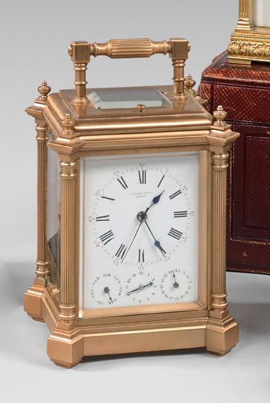 null Rare and large cage clock in a brass frame with four fluted columns. Enamel...