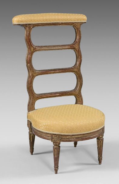 null Large beechwood chair. Openwork backrest with three moving bars. Rudent fluted...