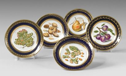 PARIS, Darte 
Five plates with polychrome decoration in the center of fruits and...