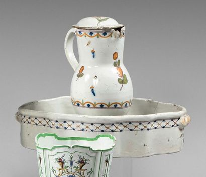 CENTRE Covered pitcher and its oval bowl decorated with flowers and garlands.
18th...