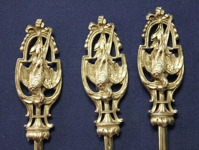 null Suite of thirteen silver plated metal hâtelets, the openwork grip showing woodcocks.
Christofle,...