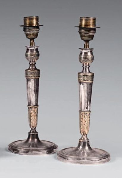 null Pair of silver plated metal torches decorated with palmettes and acanthus leaves....