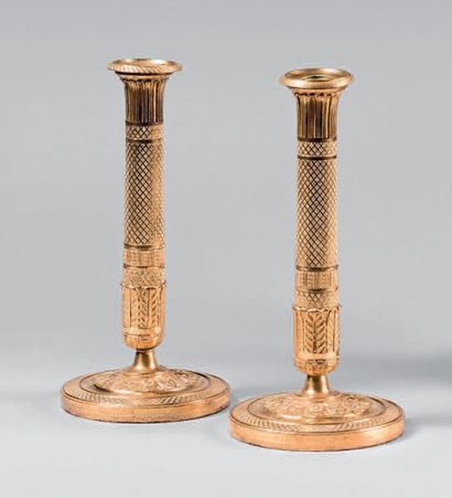 null Pair of gilt bronze torches richly decorated with squares, palms and escutcheon...