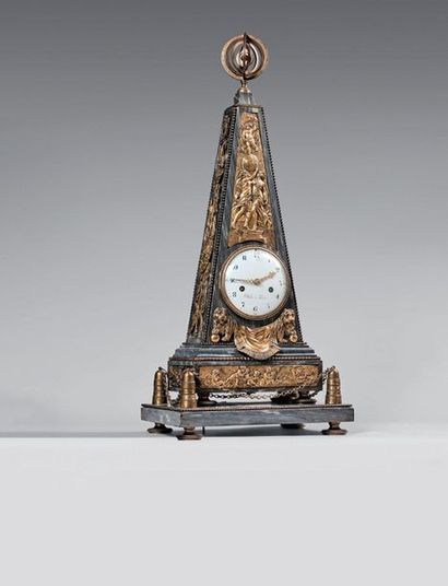  Large obelisk-shaped clock in turquoise blue marble. Rich ornamentation of gilded...