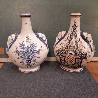 null Pair of flat ovoid gourds in polychrome earthenware decorated with characters...