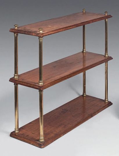 null Mahogany three-tier hanging shelf with brass column uprights.
19th century.
Height:...