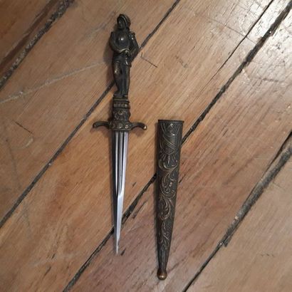 null Small belt or desk dagger in the style
Renaissance. Carved handle representing...