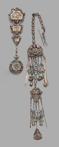 null Set of two openwork silver castelaines decorated with vine branches holding...