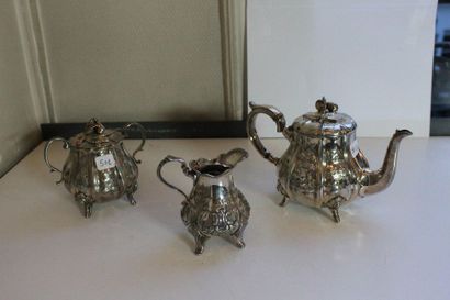 null Three-piece tea service in silver plated metal with pinched sides and engraved...