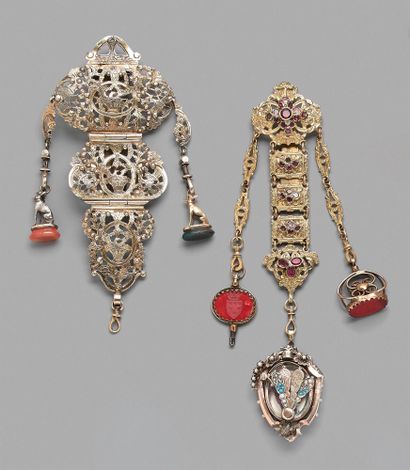 null Two chatelaines, one in vermeil formed of openwork medallions in fall with decoration...