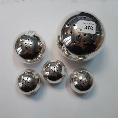 null A set of five plain silver plated saltshakers of spherical shape, the pierced...
