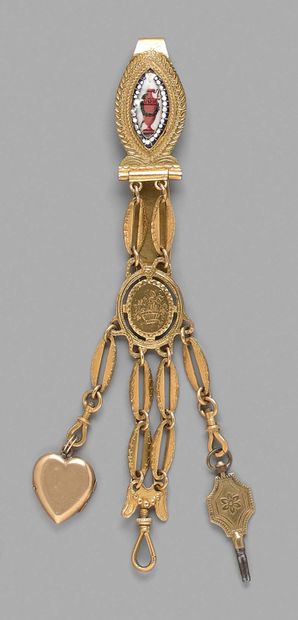 null A gilt metal chatelaine decorated with a polychrome enamel pattern with an amphora,...