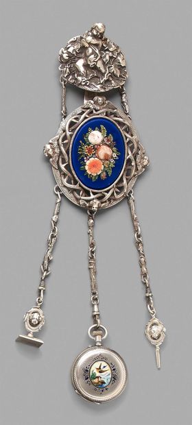 null Silver chatelaine decorated with putti, supporting a medallion-brooch decorated...