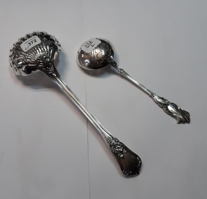 null Two silver sugar spoons 950 thousandths, a smaller model rocaille monogrammed,...