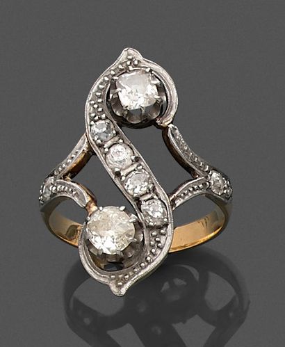 null Two-tone gold ring with openwork centre and scroll decoration, set with old-cut...