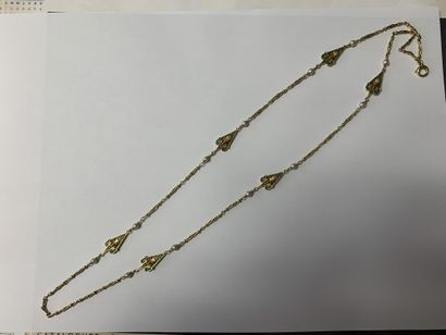 null Long necklace in yellow gold 750 thousandths, the interlaced links decorated...