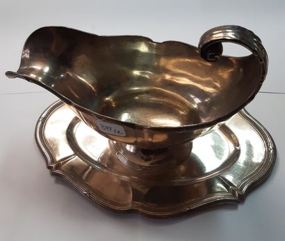 null Silvered metal lot including: a sauceboat on a sticky tray, with ribboned contours...